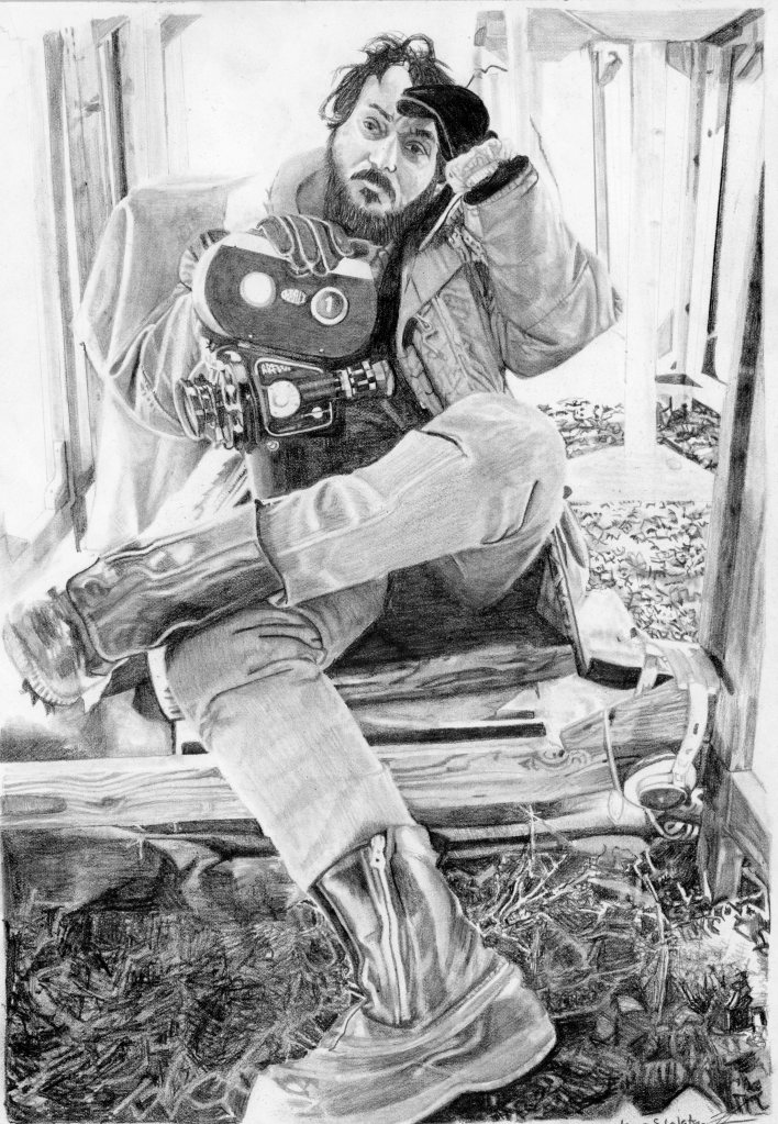 A black and white pencil drawing of a man sitting with a film camera, looking thoughtfully while resting his hand on his head. He wears a coat and boots, with a rustic background suggesting a creative workspace.